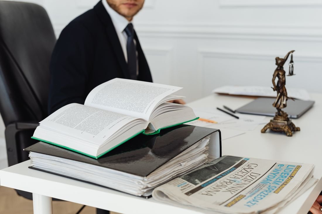 Legal reference books and documents arranged on an office desk