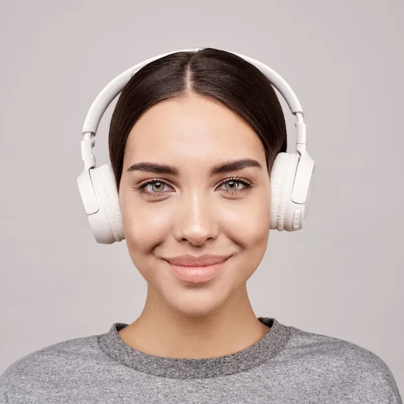 A model wearing Halo headphones in Chalk